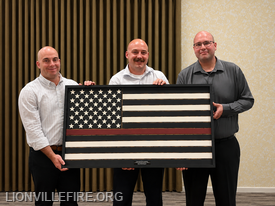 Firefighter of the Year Firefighter/EMT Danial Mellinger. Presented by Chief Mike Esterlis and Deputy Chief Mike Lam.